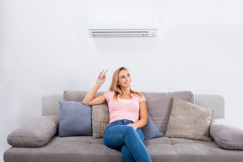 A women on a couch relaxing.