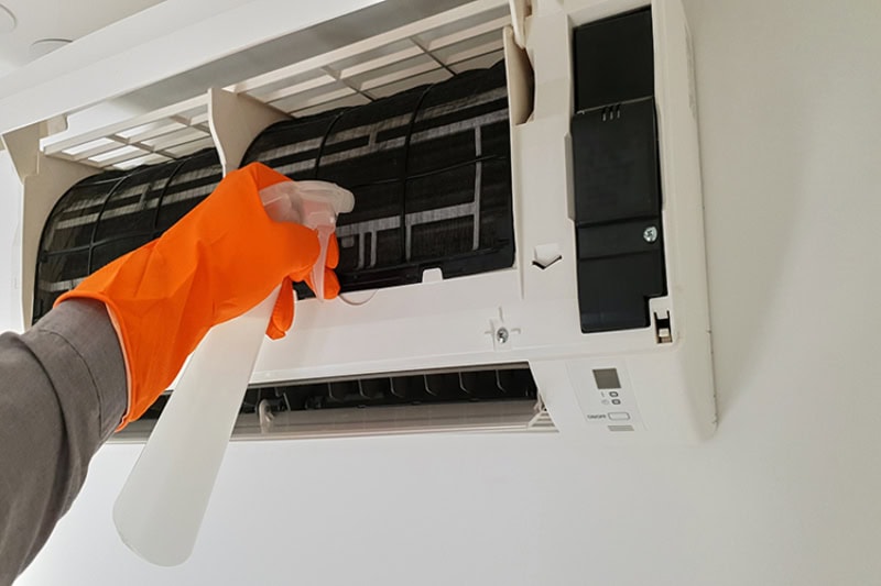 What Maintenance Is Needed for a Ductless System? Photo of someone cleaning a ductless vent.